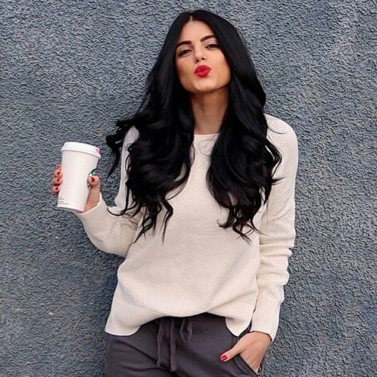 Girl with black hair and white sweater