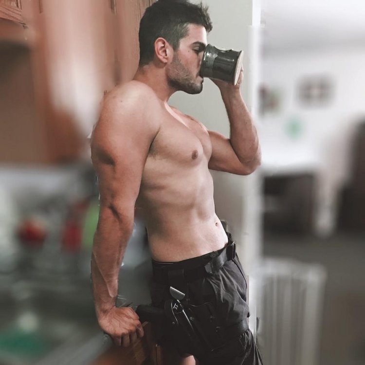 Naked man with a cup of coffee