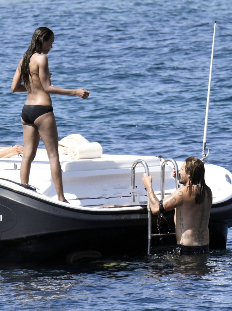Zoe Saldana draining on a yacht