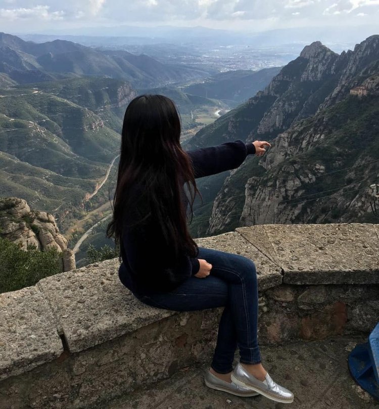 Brunette in the mountains