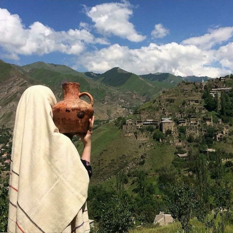 Goryanka in the mountains with a jug