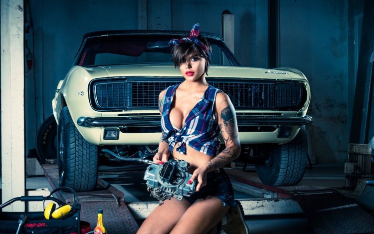 Girl in a car repair shop