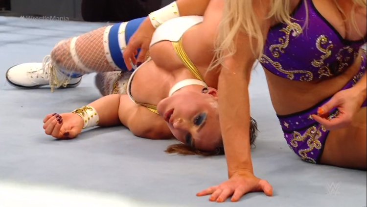 Rhea Ripley belly stab