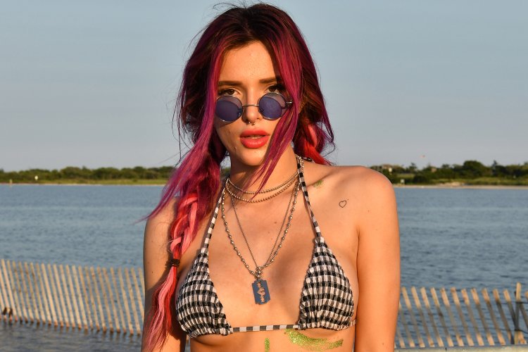 Bella +Thorne twisting tongue in Blue Bikini Video