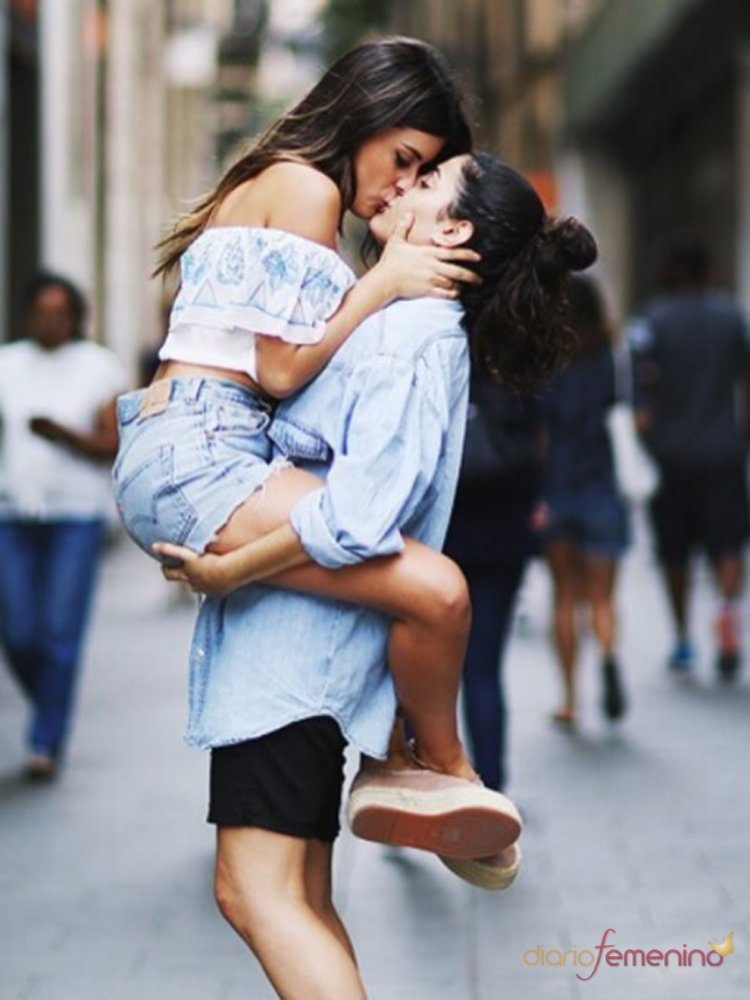 The girl lifted her friend in her arms