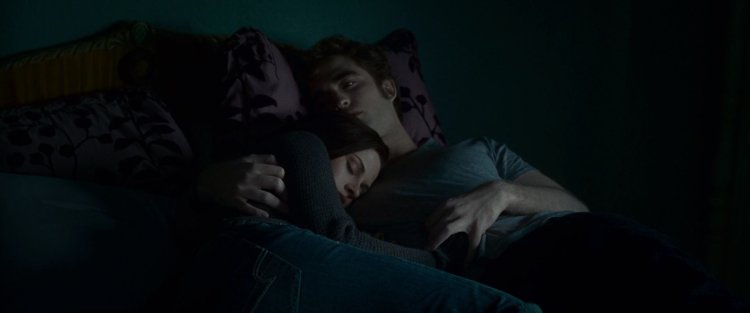 Edward and Bella Swan on the bed