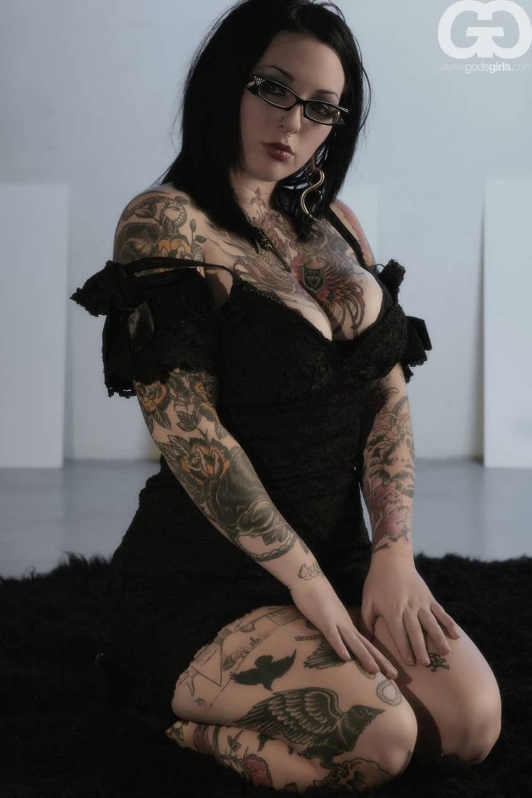 Cole Sprouse on a chair