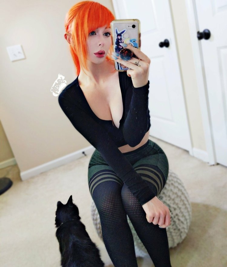 Red-haired girl in a tracksuit