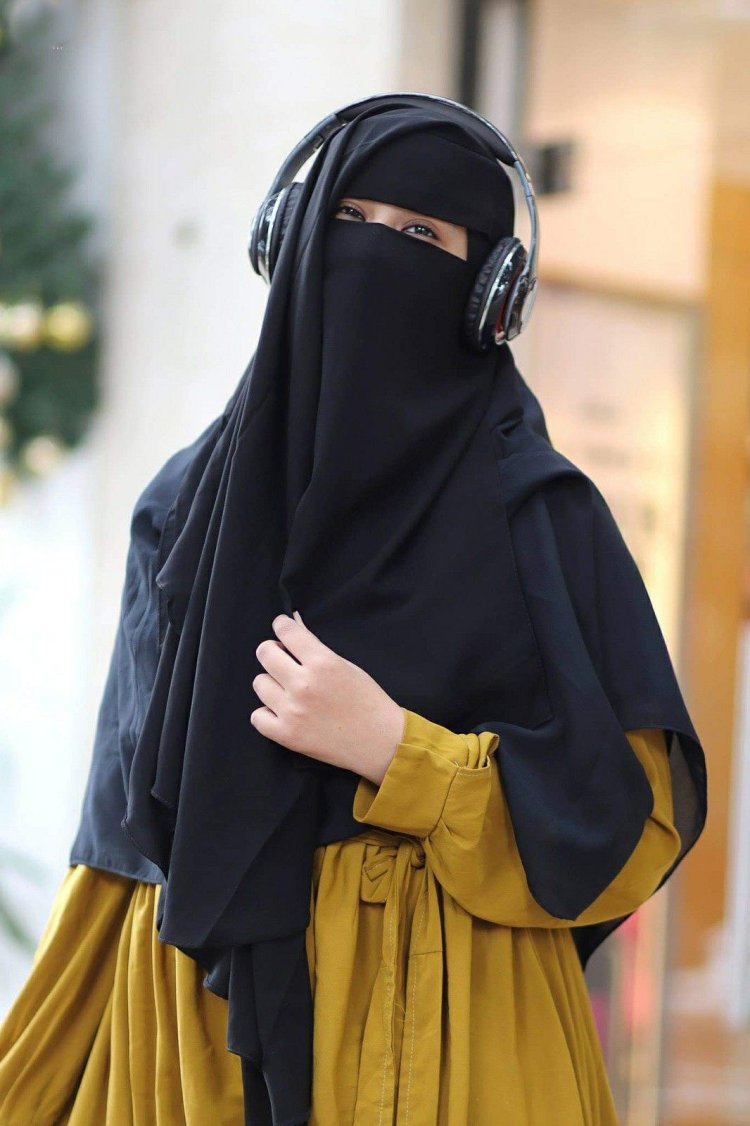 Muslim woman in a raincoat