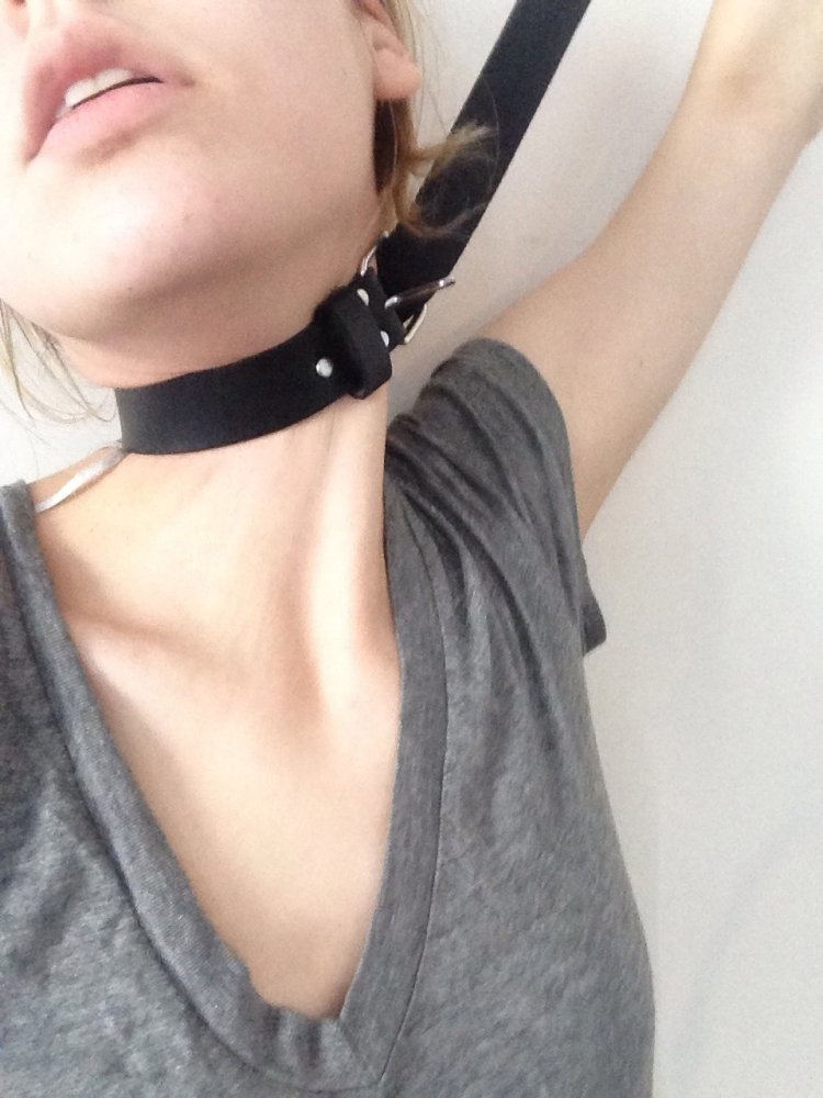 Girl with a belt around her neck