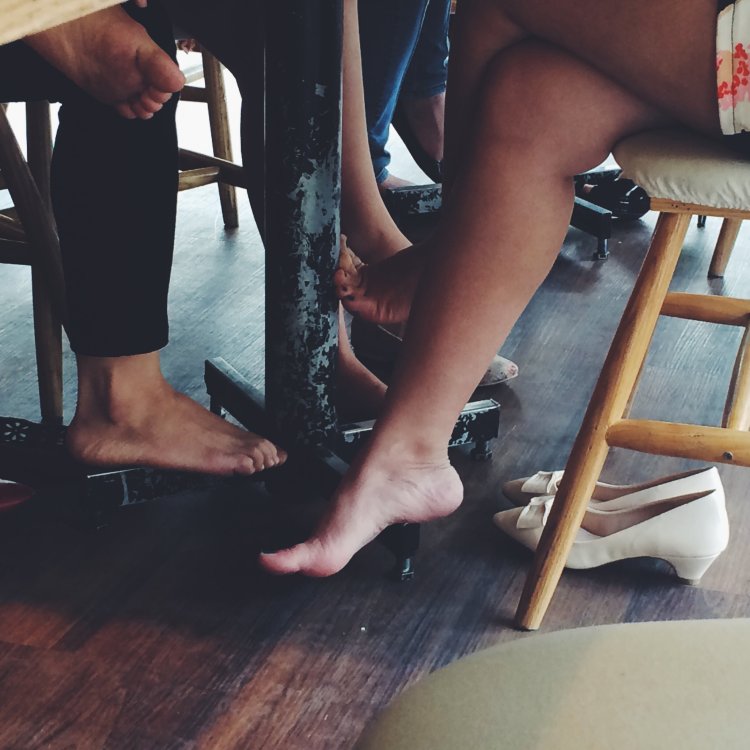 Bare feet under the table