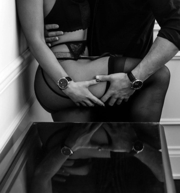 Man presses woman to table