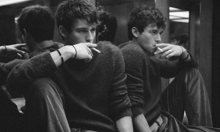 Brandon Flynn smokes