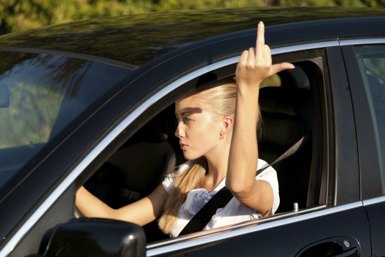 Man peeking out of the car