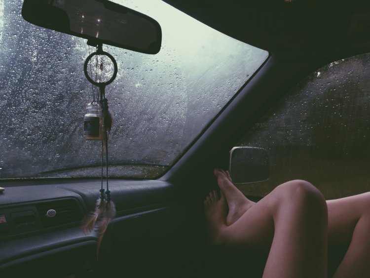 Girl in the car rain