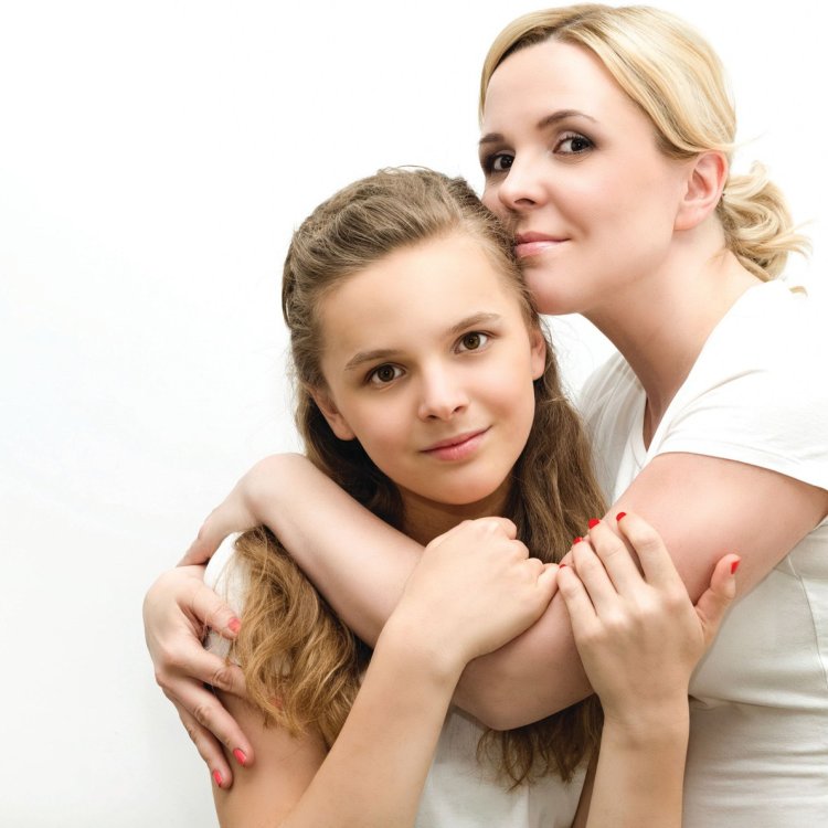Mom with a teenager on a white background