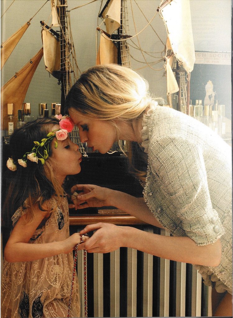 Mother and daughter kiss