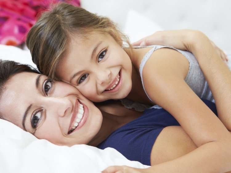 Mom hugging in bed
