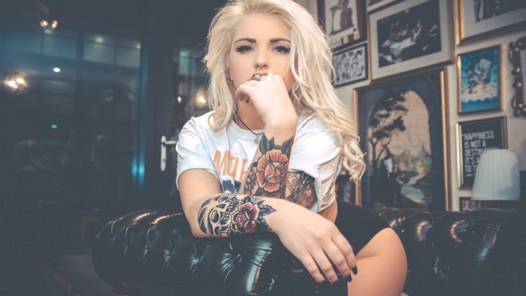 Blonde girl with tattoo