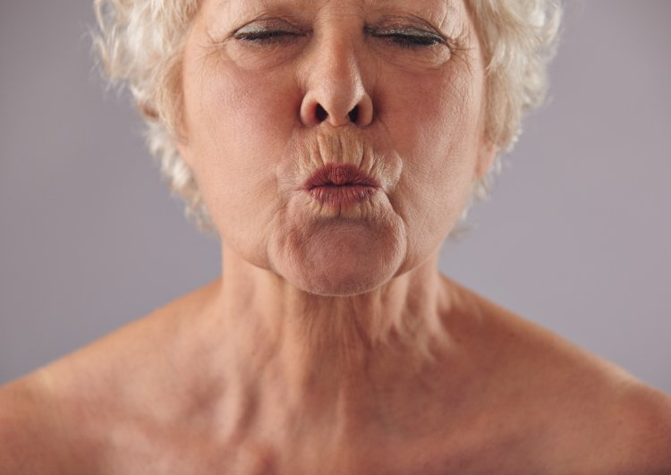 Elderly women with open mouth