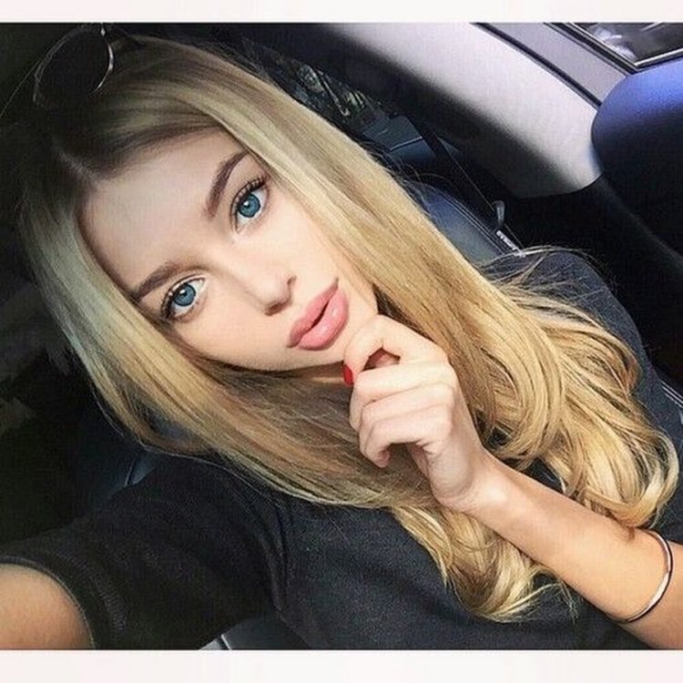 Blonde girl with blue eyes selfie
