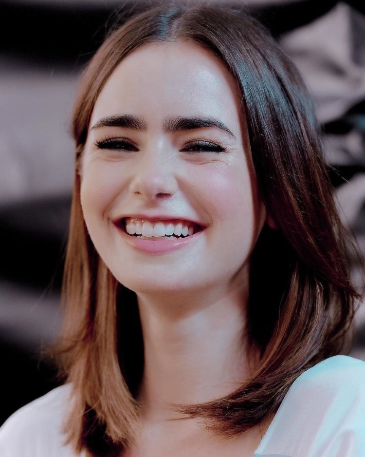 Lily Collins smiling