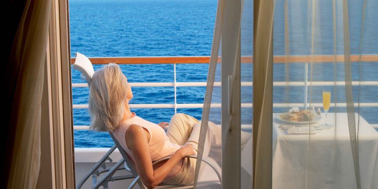 Girl on the balcony overlooking the sea
