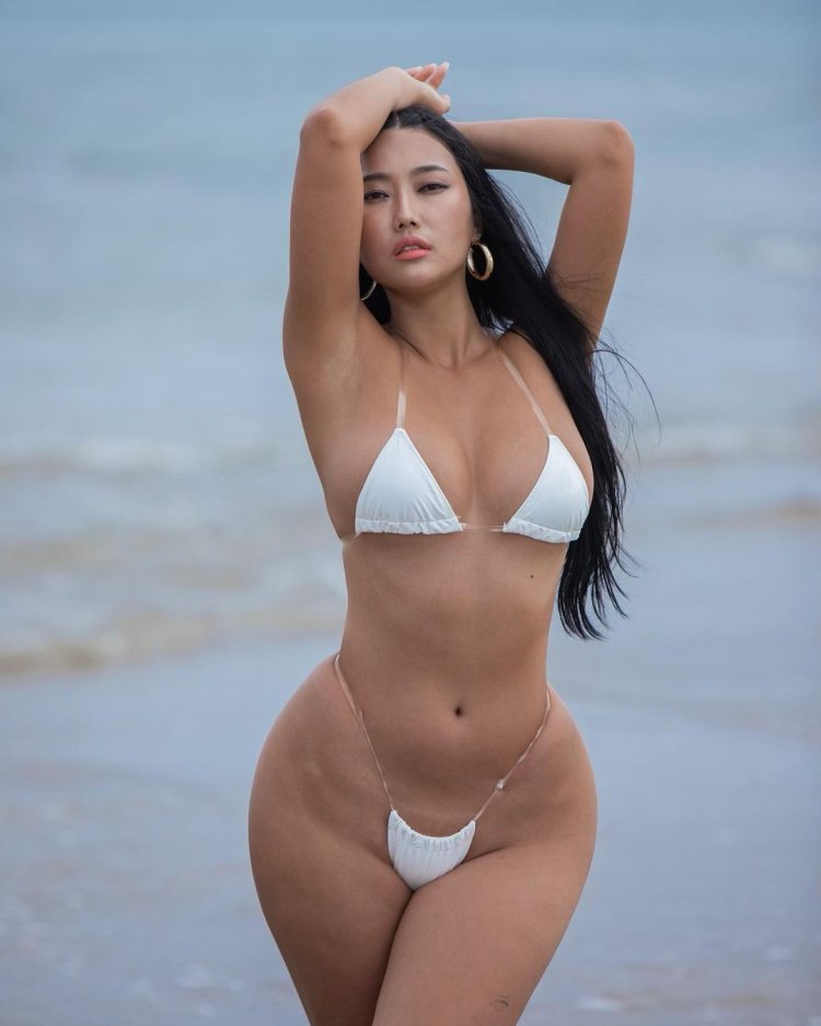 Jayden James at the mirror in a dress