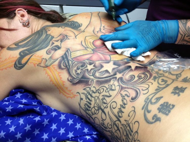 Woman in tattoo parlor