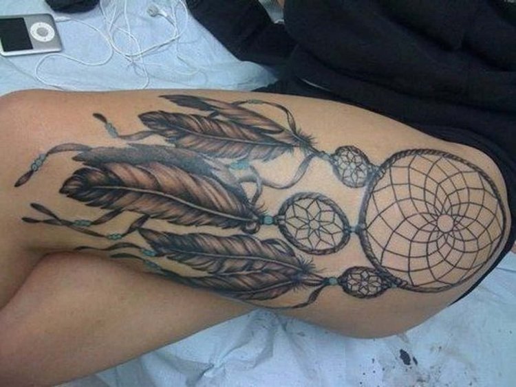 Dreamcatcher tattoo for girls on the thigh