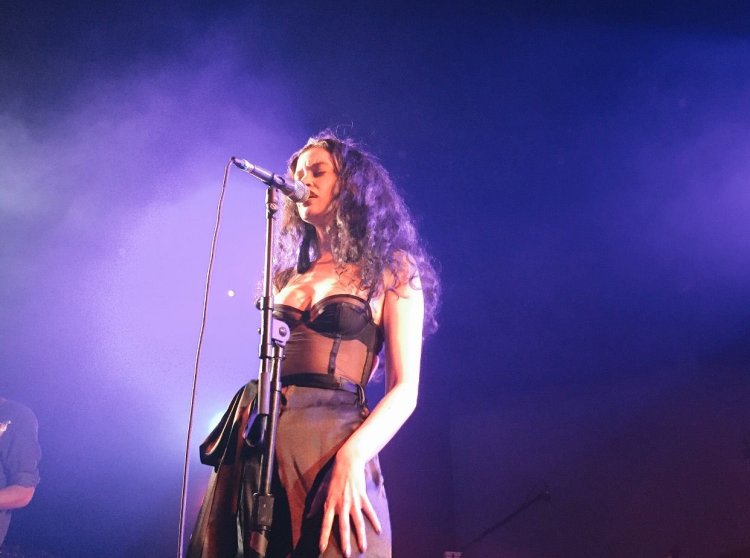 Sabrina Claudio in short performance dress