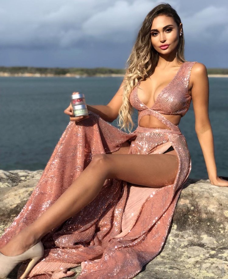 Girls in tight mini dresses on a bench