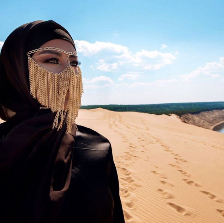 Girl in hijab in the desert