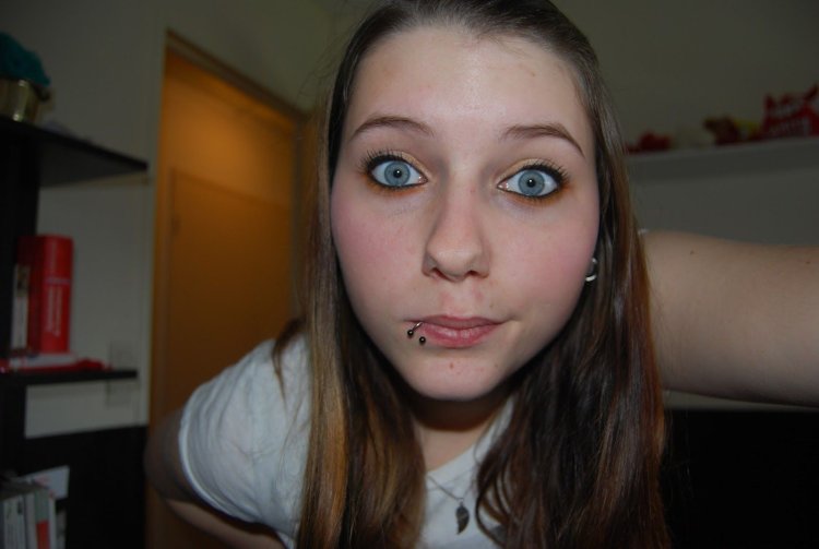 A girl with a beautiful figure and a scary face