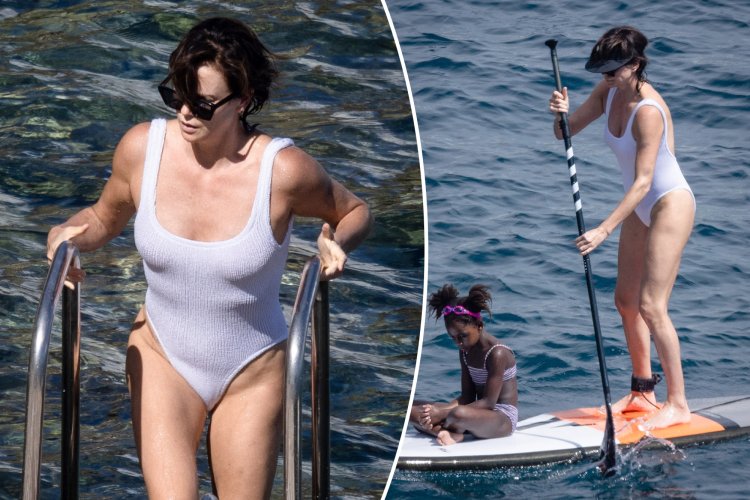 Charlize Theron between legs