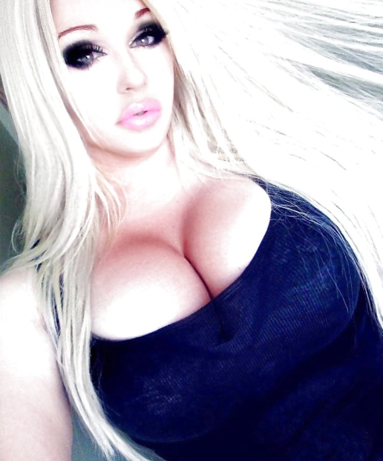 Huge silicone breasts in latex