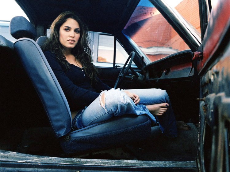 Girl sitting on the car