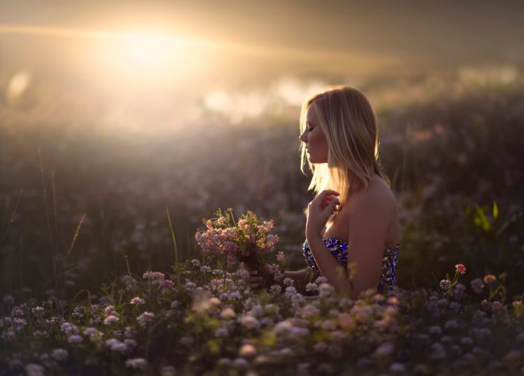 Girl in the field in the evening