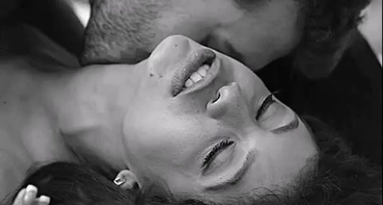 A gentle kiss on a woman's neck