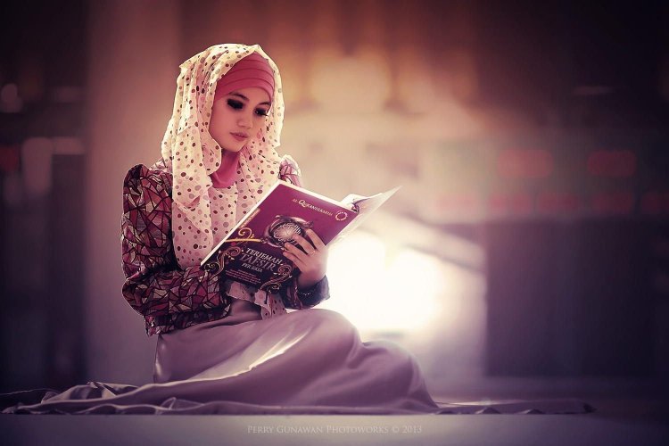 Muslim woman and Koran