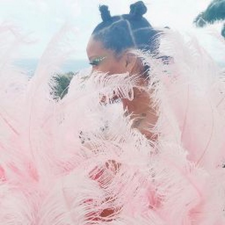 Girl in pink feathers and glasses