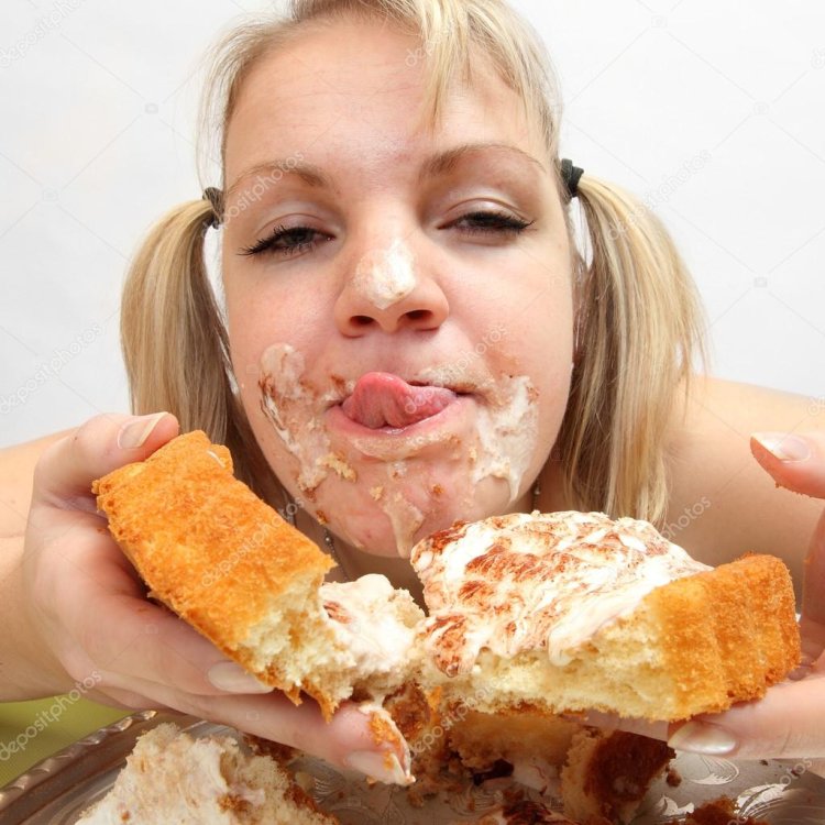 Food in girl's mouth