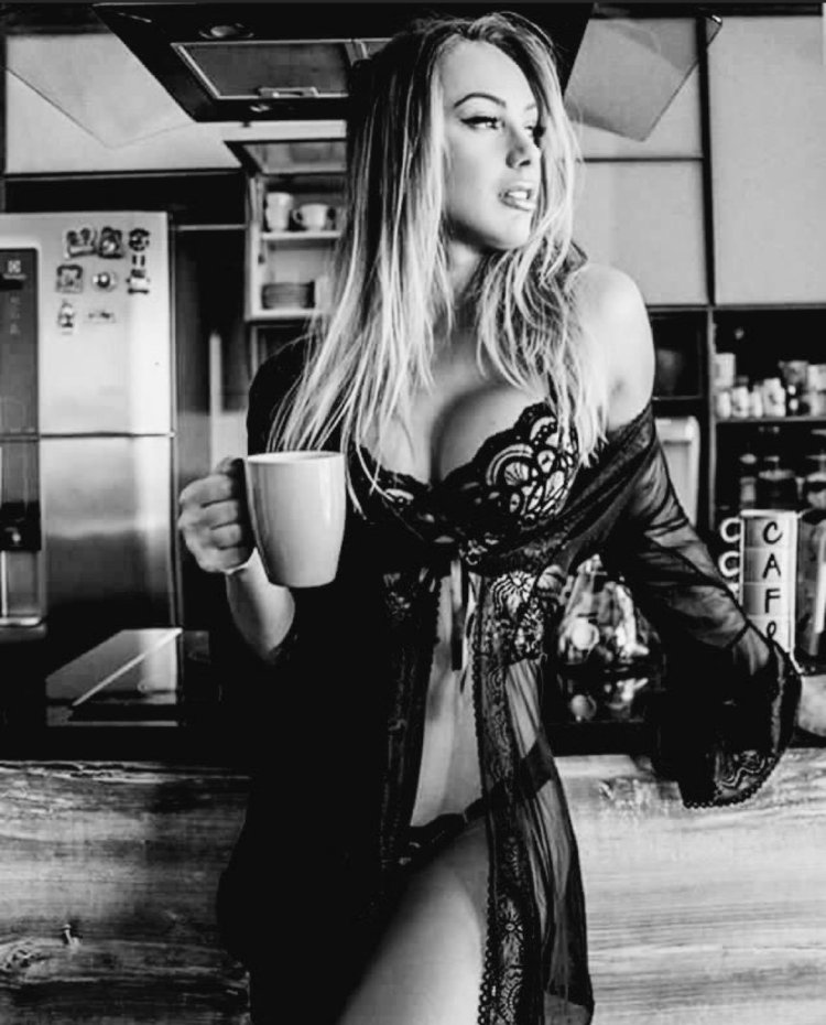 Girl in lingerie with a cup of coffee