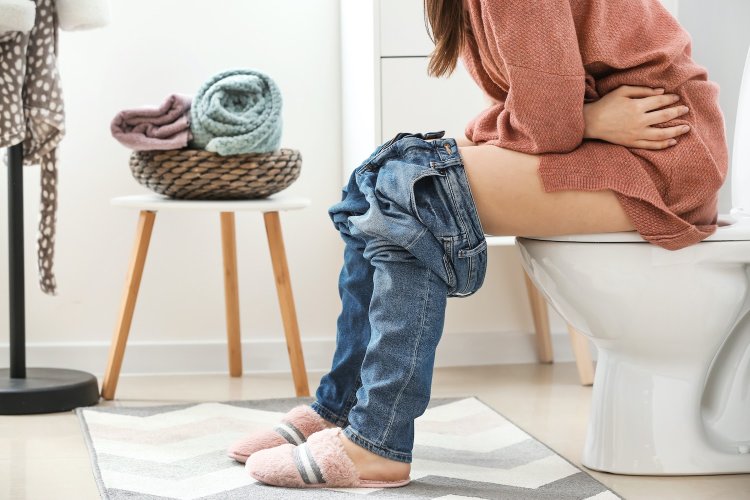 Woman sitting on a potty