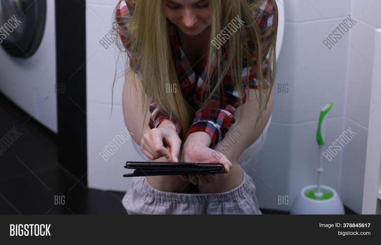 The girl runs to the toilet