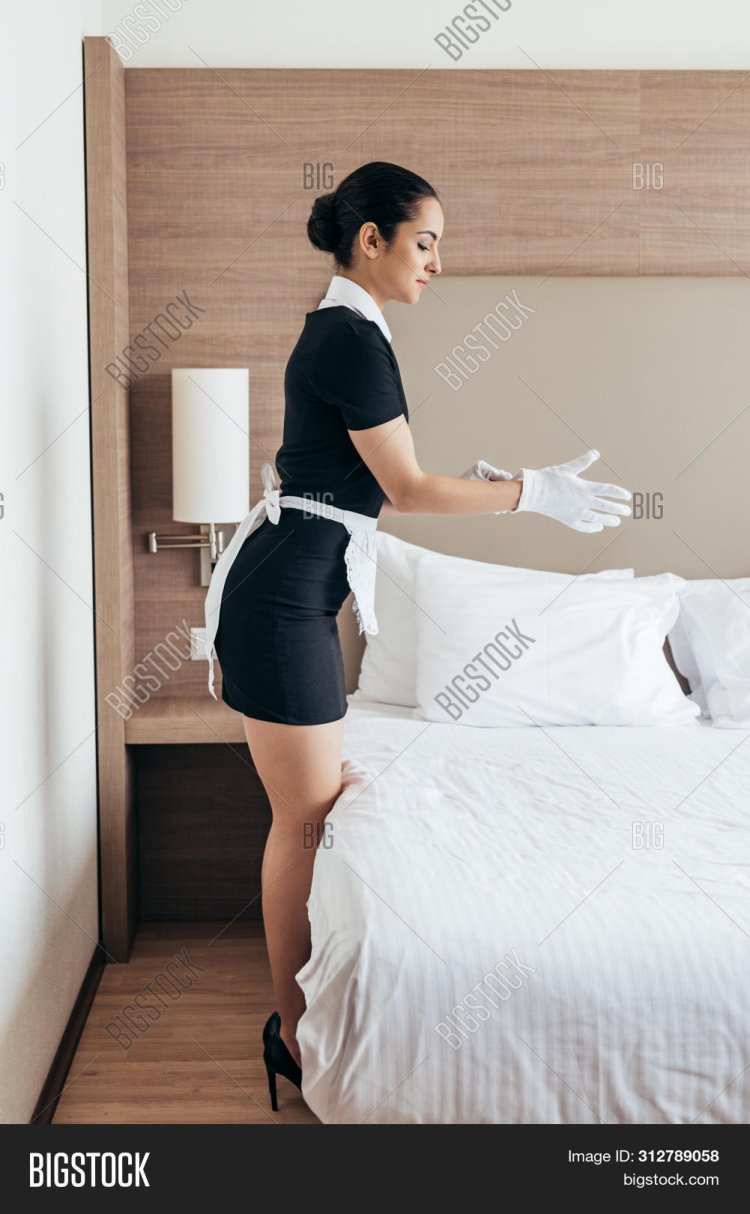 Hotel maid in apron