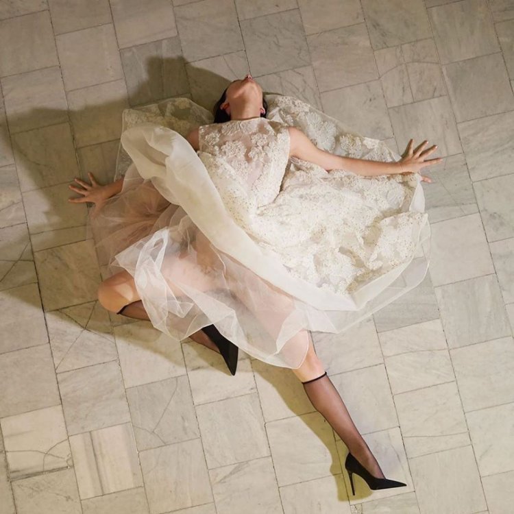 Woman in swoon and puffy dress