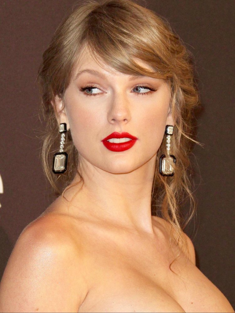 Girl in stockings on the bed