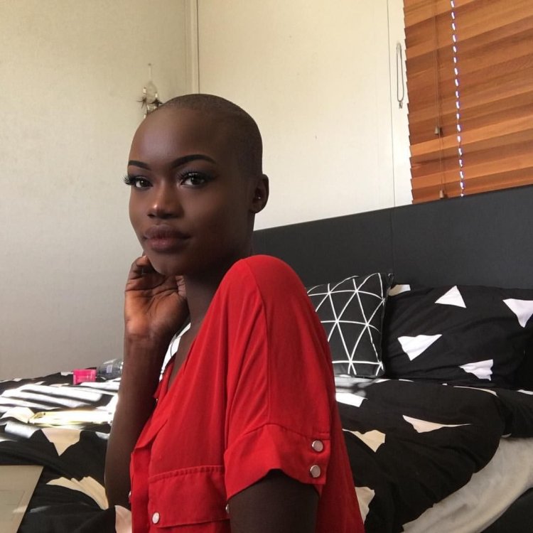Bald dark-skinned girl in full growth