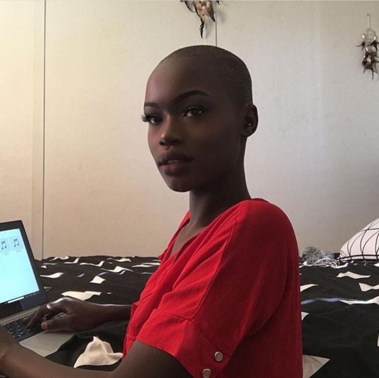 Bald black woman pregnant